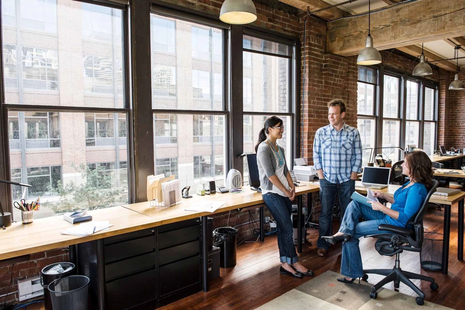 A group of people in an office setting.