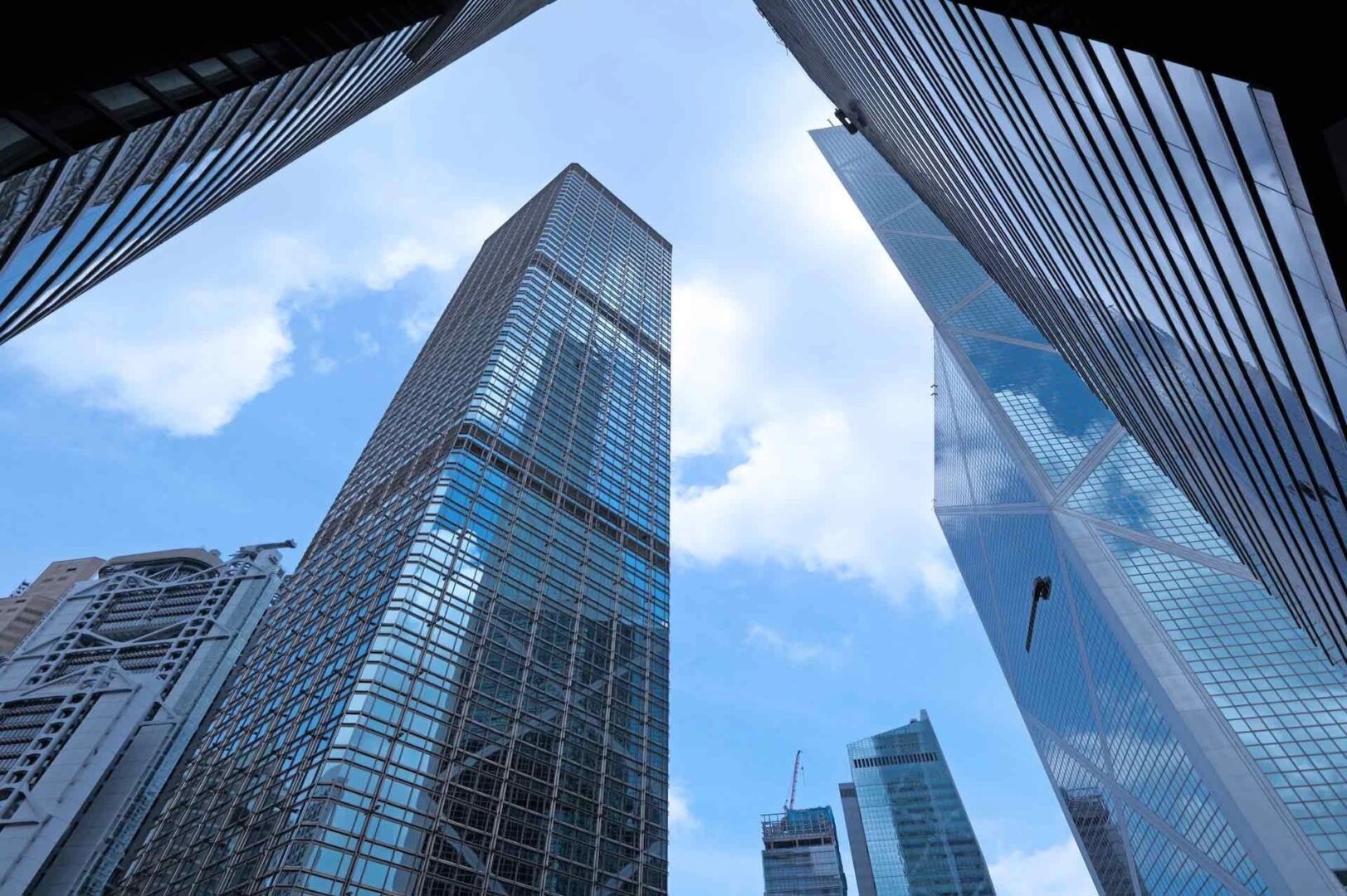 A view of some skyscrapers from below the ground.